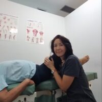 Dr. Meiri adjusts the patient's hip