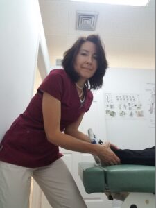 Dr Natalie Meiri adjusts a patient's ankle