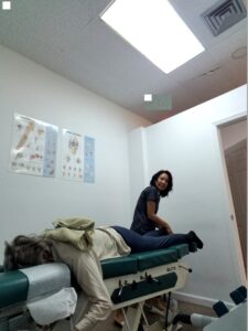 Dr. Natalie Meiri adjusts the patient's foot