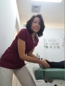 Dr Meiri adjusts a patient's ankle